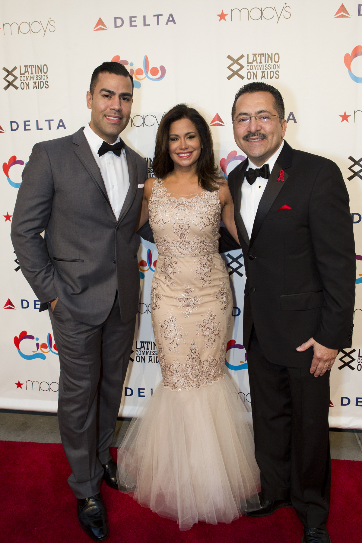 Co-hosts, actor JW Cortez and NBC4 anchor Sibila Vargas with Latino Commission on AIDS President Guillermo Chacón