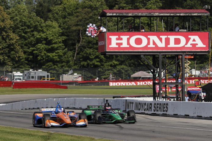 Scott Dixon, #9 Honda foreground, leads his teammate Felix Rosenqvist to the checker flags to take a narrow victory Sunday at the Honda Indy 200 NTT IndyCar Series race at the Mid-Ohio Sports Car Course.