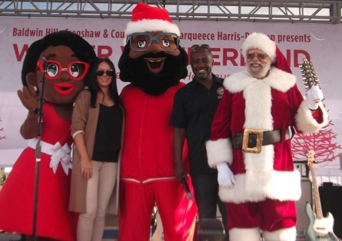 (L to R) Mrs. C., Rachel Freeman (Capri Retail Services), Black Santa, Los Angeles City Councilmember Marqueece Harris-Dawson (District 8) and Santa Claus. Photo Credit: Ricky Richardson