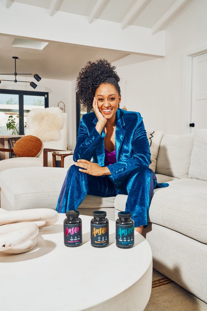 Tia Mowry with Anser supplements (PRNewsfoto/BioSchwartz)